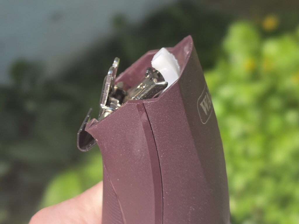 clipper without the blade showing the drive tip and the hinge for detachable blades 