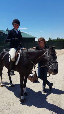 getting a black horse ready for the show ring