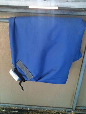 blanket folded on stall door
