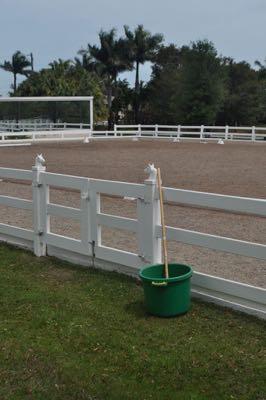 horse arena with muck tub and fork