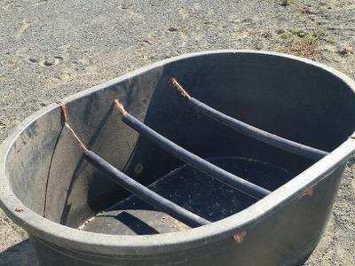 modified feed tub for hay that allow a hay net to rest inside