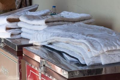 stacks of quilts at a show barn