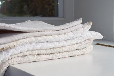 stack of horse leg quilts