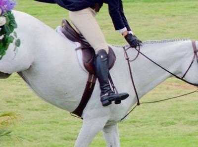 rider on a horse landing from a jump