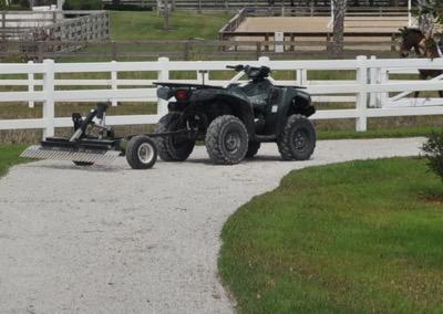 small quad vehicle for dragging the arena