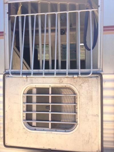 horse trailer window with bars and flip down window