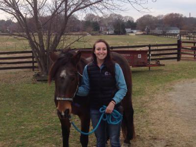 Ryan with a horse in a field