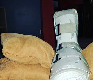 leg in cast on a pillow