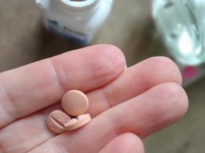 three equioxx tables in a palm