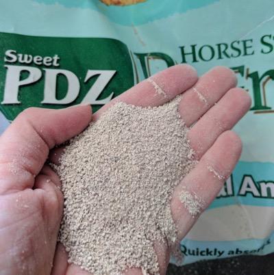 sweet pdz zeolites in hand with bag