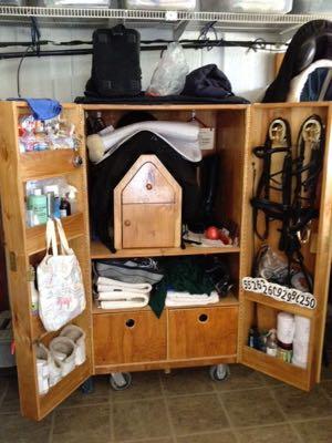 large wooden rolling tack trunk