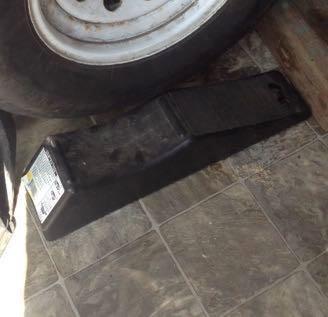 horse trailer spare tire and jack in the tack room