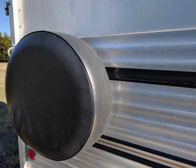 spare tire cover on a horse trailer
