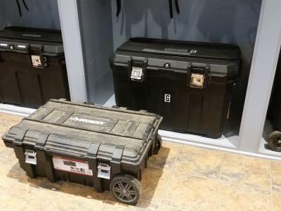 two black tack trunks with wheels