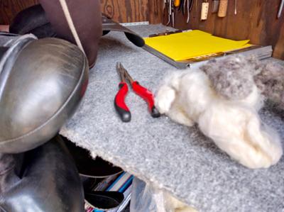 saddle flocking tools on a workbench