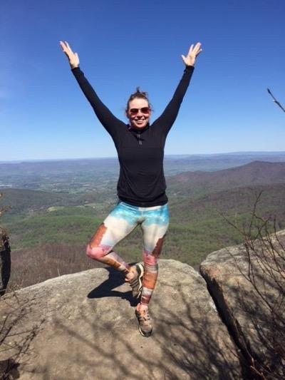 yoga tree pose on a mountain