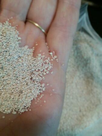 hand holding sweet pdz zeolite granules
