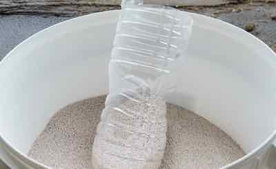 sweet pdz zeolites in container with scoop