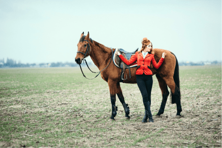 bad horse photograph of a girl whose horse has dirty boots and ears back