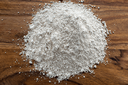a pile of white powder diatomaceous earth